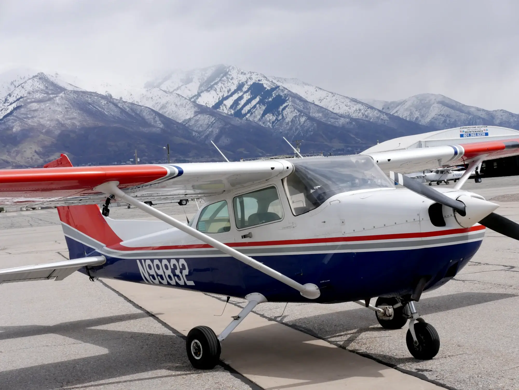 Cessna 172 at Ogden airport with Northern Utah mountains in the background