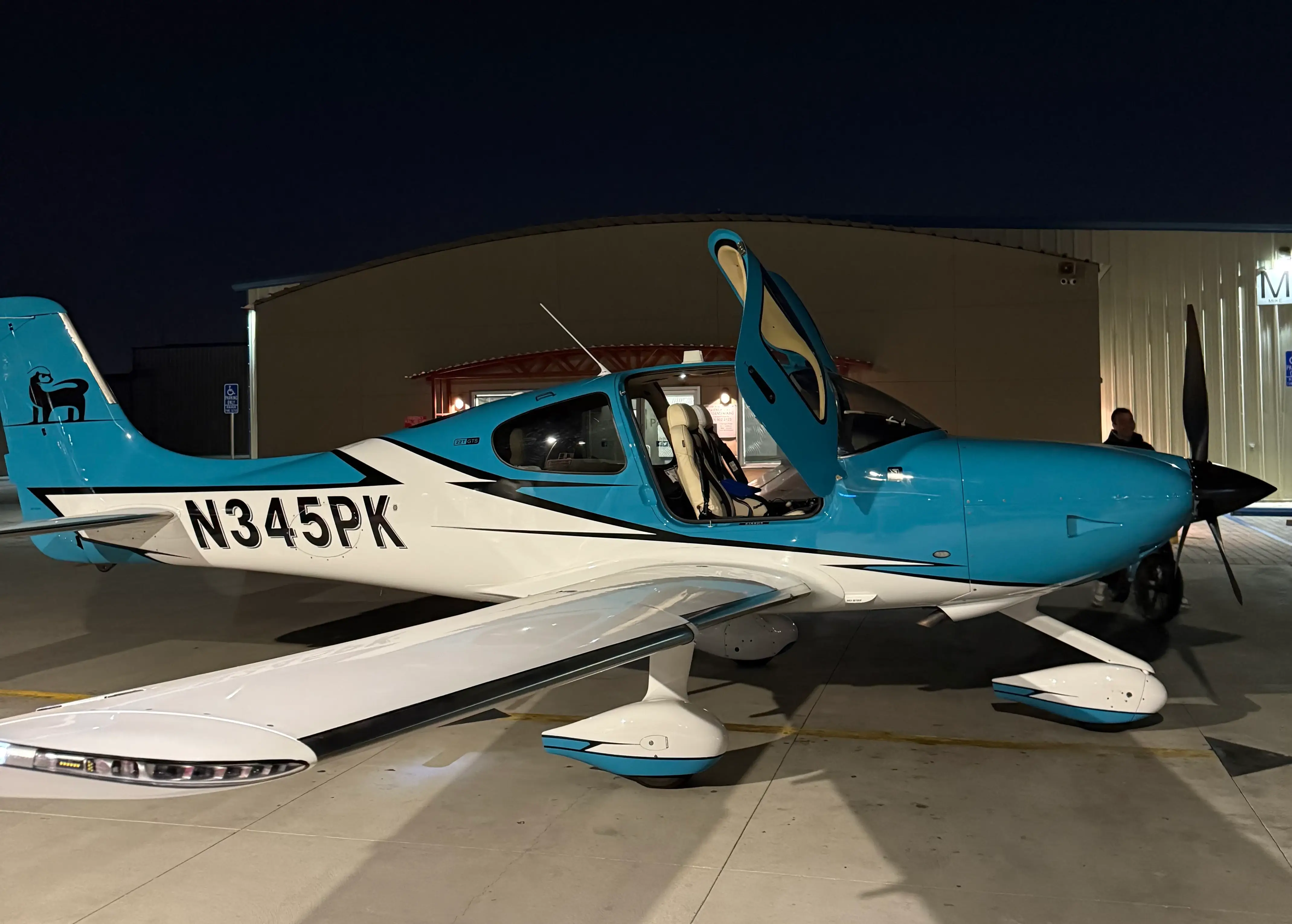 Side profile of the Cirrus SR22T N345PK on the tarmac at Blitz Aviation in Ogden, Utah
